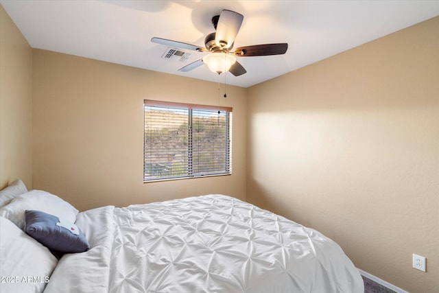 bedroom with baseboards, visible vents, and a ceiling fan