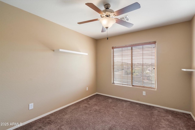 carpeted spare room with visible vents, ceiling fan, and baseboards