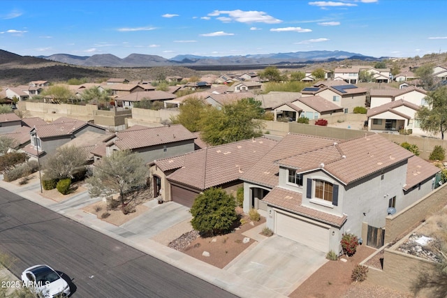 bird's eye view with a residential view and a mountain view