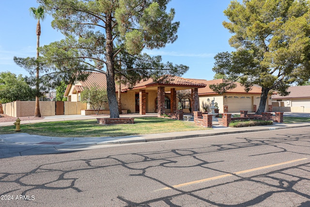 mediterranean / spanish house with a garage