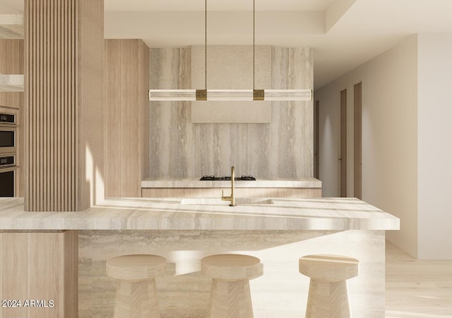 interior space featuring light brown cabinetry and light hardwood / wood-style floors