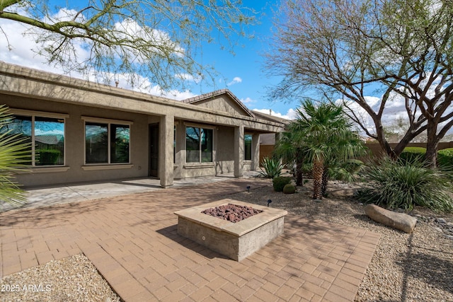 view of patio featuring a fire pit