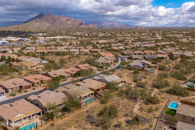 birds eye view of property featuring a mountain view and a residential view