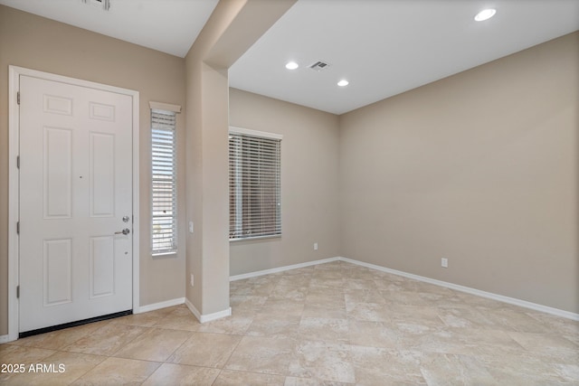 foyer entrance featuring recessed lighting, visible vents, and baseboards