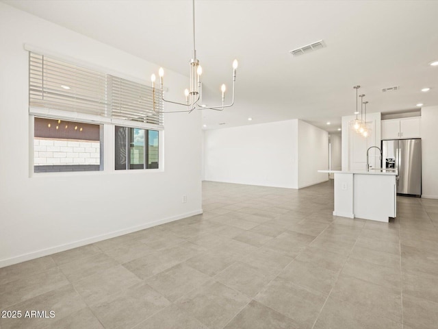 4032 S 176th Dr, Goodyear, AZ 85338 - spare room featuring a chandelier and recessed lighting
