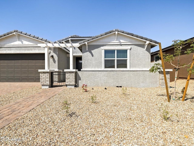 4032 S 176th Dr, Goodyear, AZ 85338 - view of front of home with a garage, stucco siding, and a tiled roof