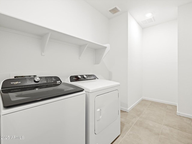 4032 S 176th Dr, Goodyear, AZ 85338 - washroom featuring independent washer and dryer and light tile patterned floors