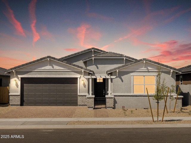 4032 S 176th Dr, Goodyear, AZ 85338 - ranch-style house featuring an attached garage, decorative driveway, and a tiled roof