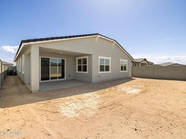 4032 S 176th Dr, Goodyear, AZ 85338 - back of house with a fenced backyard, a patio area, and stucco siding