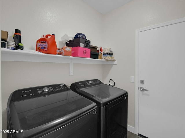 laundry area featuring laundry area, baseboards, and independent washer and dryer