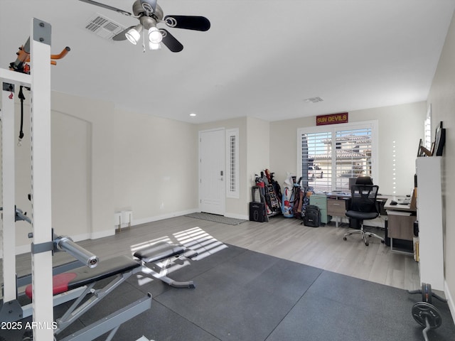 workout room with a ceiling fan, visible vents, and baseboards