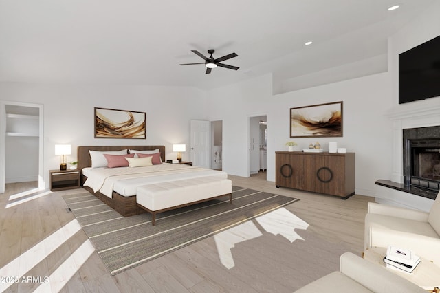 bedroom with ceiling fan and light hardwood / wood-style flooring