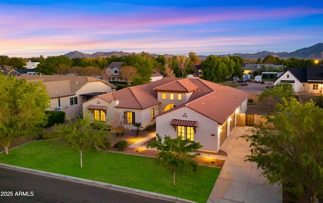 17755 E Colt Dr, Queen Creek, AZ 85142 - view of front of home with stucco siding, a mountain view, concrete driveway, a front yard, and a tiled roof