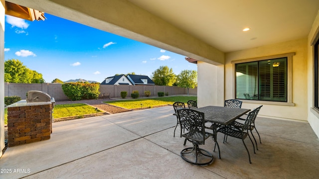 17755 E Colt Dr, Queen Creek, AZ 85142 - view of patio featuring a fenced backyard, area for grilling, and outdoor dining space