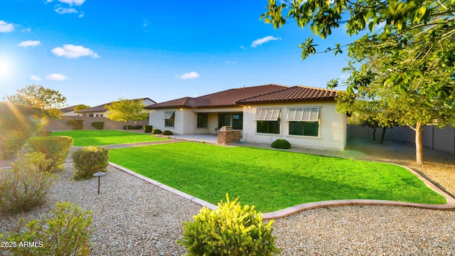 17755 E Colt Dr, Queen Creek, AZ 85142 - back of property featuring a fenced backyard, stucco siding, a tile roof, a patio area, and a lawn