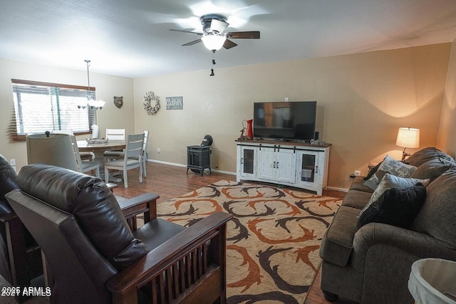 1449 Elk Dr, Forest Lakes, AZ 85931 - living room with wood-type flooring and ceiling fan with notable chandelier