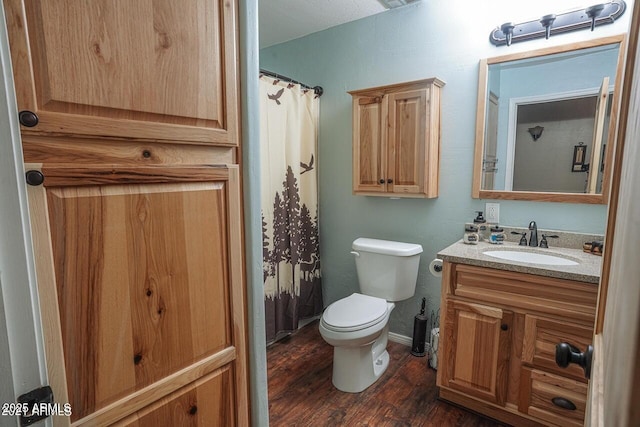 1449 Elk Dr, Forest Lakes, AZ 85931 - bathroom featuring vanity, hardwood / wood-style flooring, and toilet