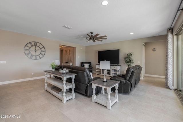 tiled living room featuring ceiling fan