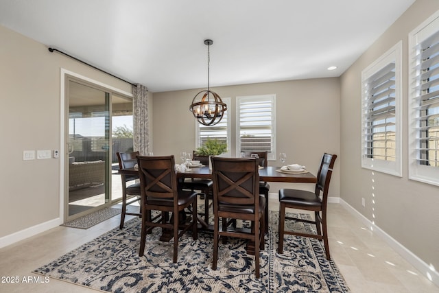 dining area with a notable chandelier and light tile patterned floors