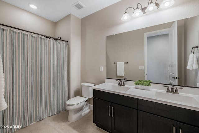 bathroom featuring toilet, tile patterned floors, a shower with shower curtain, and vanity