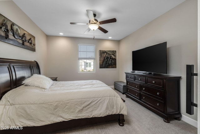 bedroom featuring ceiling fan and light colored carpet