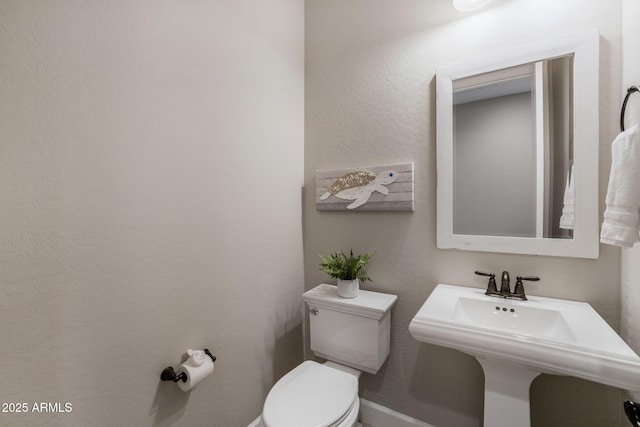 bathroom with sink and toilet