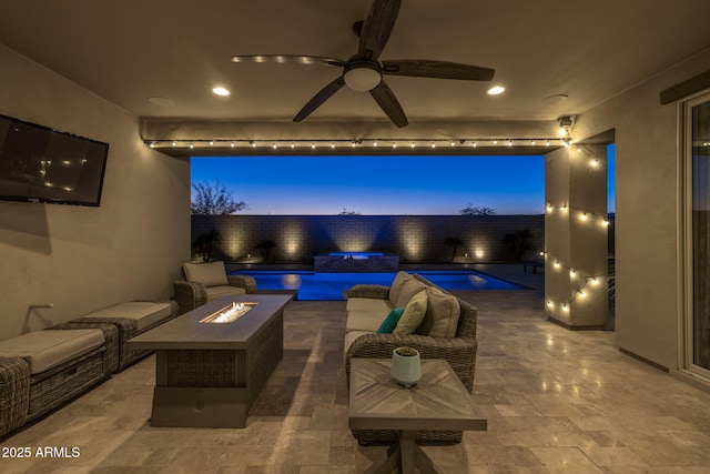 patio terrace at dusk with an outdoor living space with a fire pit and a fenced in pool