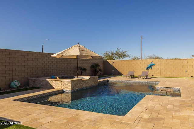 view of swimming pool with an in ground hot tub and a patio