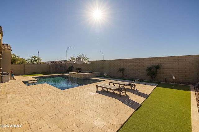 view of swimming pool with a patio and an in ground hot tub