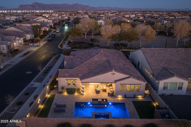 aerial view at dusk with a mountain view