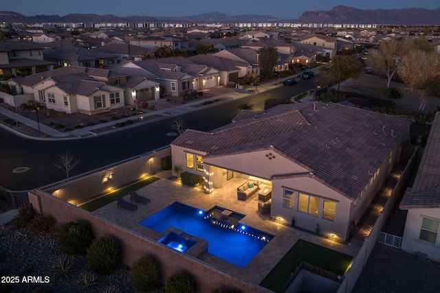 birds eye view of property with a mountain view