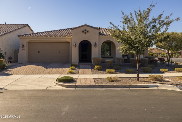 mediterranean / spanish-style home featuring a garage