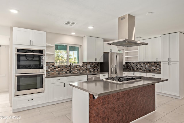 kitchen with open shelves, stainless steel appliances, visible vents, a sink, and island range hood