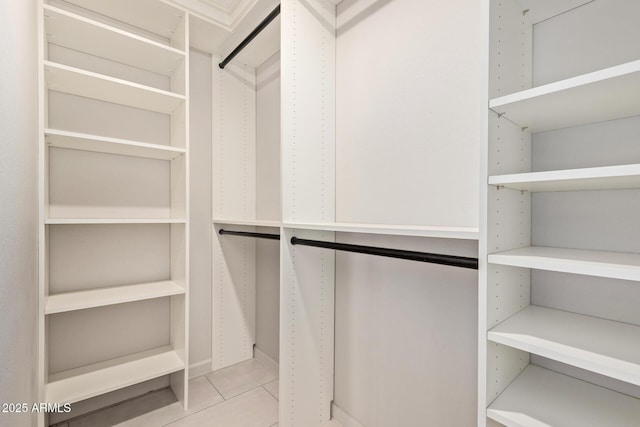 spacious closet with tile patterned flooring