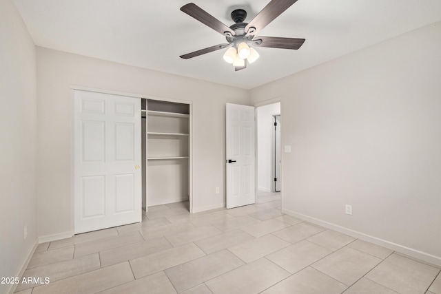 unfurnished bedroom with a ceiling fan, a closet, and baseboards