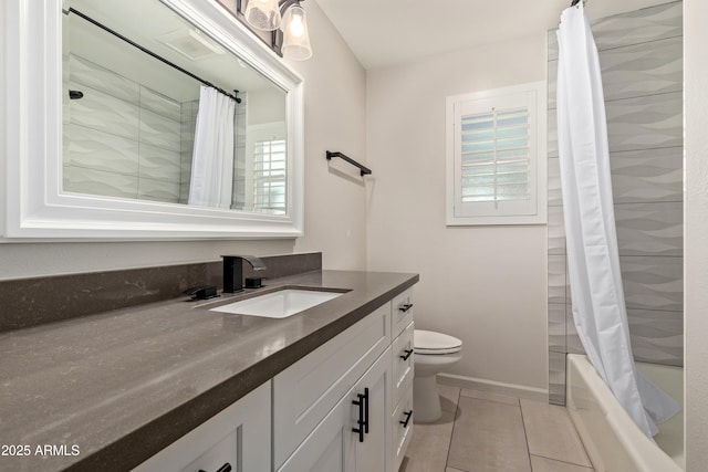 full bathroom with toilet, shower / bath combo with shower curtain, vanity, baseboards, and tile patterned floors