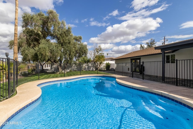 view of swimming pool with fence and a fenced in pool