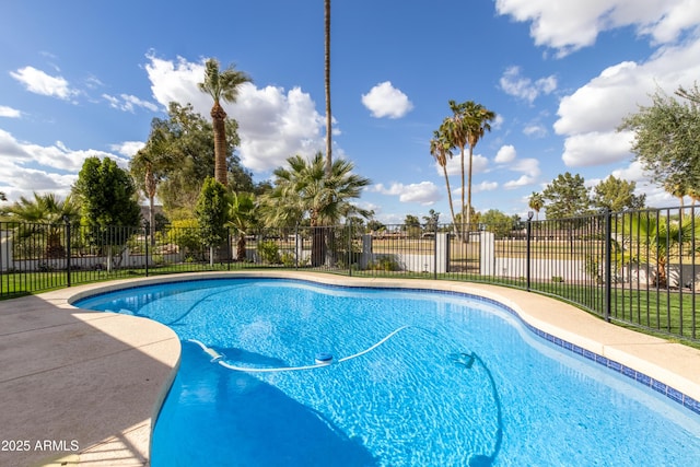 view of pool with a fenced in pool and fence