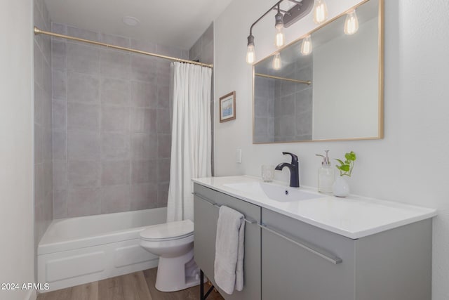 full bathroom with toilet, vanity, shower / tub combo, and hardwood / wood-style flooring