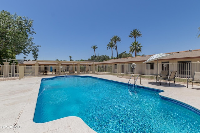 view of pool featuring a patio area