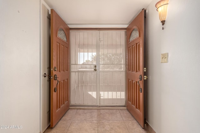 entryway featuring light tile patterned floors