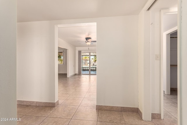 corridor with light tile patterned floors