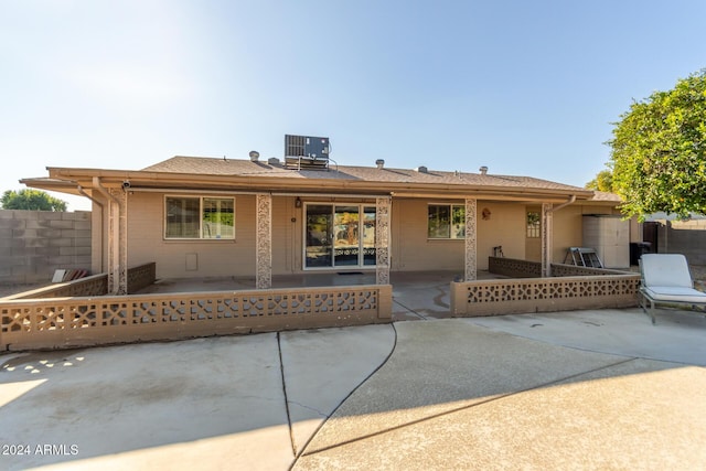 back of house with a patio and central AC