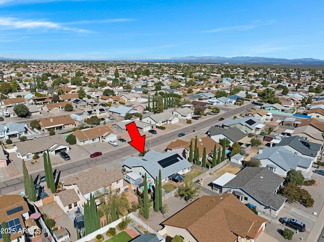 birds eye view of property featuring a mountain view