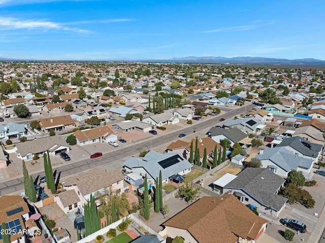 birds eye view of property with a mountain view