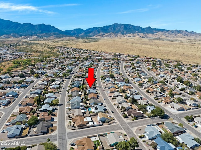 birds eye view of property with a mountain view