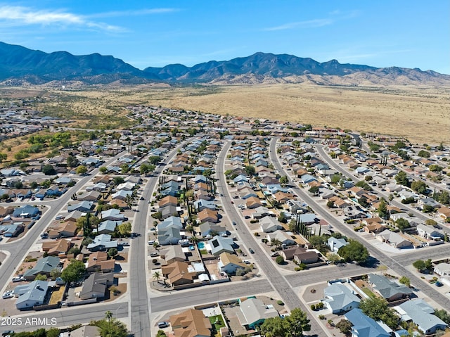 birds eye view of property featuring a mountain view