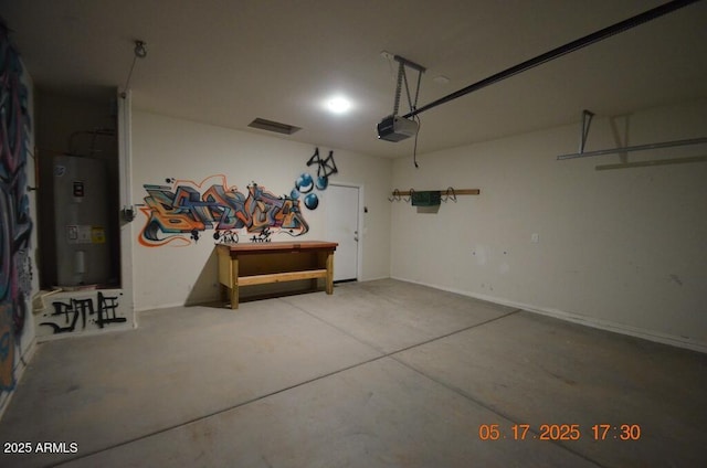 24646 N Barley Rd, Florence, AZ 85132 - garage with electric water heater, a garage door opener, and baseboards