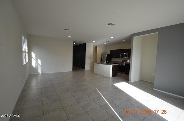 24646 N Barley Rd, Florence, AZ 85132 - unfurnished living room featuring light tile patterned flooring, recessed lighting, and baseboards