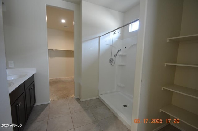 24646 N Barley Rd, Florence, AZ 85132 - full bath with vanity, a shower, a walk in closet, and tile patterned flooring
